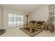 Comfortable living room with a large window with shutters and stylish decor at 3262 Westcott Ct, Palm Harbor, FL 34684