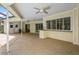 Covered patio area with ceiling fans, a wet bar, and view of the pool at 3262 Westcott Ct, Palm Harbor, FL 34684