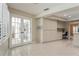 Sun room features neutral tile floors and access to the kitchen with a set of charming french doors at 3262 Westcott Ct, Palm Harbor, FL 34684