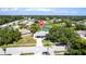 Charming one-story home with lovely landscaping, complemented by a serene pond in a picturesque neighborhood setting at 3312 Kenmore Dr, Sarasota, FL 34231