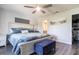 Bedroom featuring wood floors, ceiling fan, walk-in closet and an adjoining bathroom at 3312 Kenmore Dr, Sarasota, FL 34231