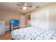 Comfortable bedroom with ceiling fan, TV, closet, and marine decorations at 3312 Kenmore Dr, Sarasota, FL 34231