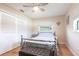 Relaxing bedroom featuring seaside decor, natural light, ceiling fan, and closet at 3312 Kenmore Dr, Sarasota, FL 34231