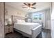 Bedroom featuring wood floors, neutral walls and ceiling fan and a small window at 3312 Kenmore Dr, Sarasota, FL 34231