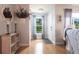 Bright foyer with hardwood floors, decorative mirror, and natural light, creating a warm entry at 3312 Kenmore Dr, Sarasota, FL 34231