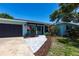 Charming one-story home with a two-car garage, manicured lawn, and lovely front yard landscaping at 3312 Kenmore Dr, Sarasota, FL 34231