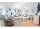 Spacious living room featuring hardwood floors, plush seating, and ample natural light creating a comfortable atmosphere at 3312 Kenmore Dr, Sarasota, FL 34231