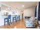 Inviting living room with bar seating and a view of the stainless steel appliances in kitchen at 3312 Kenmore Dr, Sarasota, FL 34231