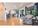 Open living room featuring hardwood floors, with slider doors to let in natural light at 3312 Kenmore Dr, Sarasota, FL 34231