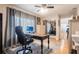 Spacious office featuring a dark wood desk, comfortable chair, and plenty of natural light at 3312 Kenmore Dr, Sarasota, FL 34231