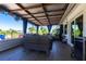 Inviting covered patio featuring comfortable seating, stylish decor, and serene outdoor views at 3312 Kenmore Dr, Sarasota, FL 34231