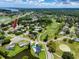 Aerial view of neighborhood, golf course, ponds, and conservation areas at 335 Palmdale Dr, Oldsmar, FL 34677