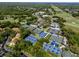 Aerial view of the expansive East Lake Woodlands community with tennis courts, pools, and golf course at 335 Palmdale Dr, Oldsmar, FL 34677