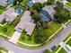 Aerial view of the property showcasing the home's landscaping, screened-in pool, and quiet cul-de-sac location at 335 Palmdale Dr, Oldsmar, FL 34677