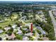 Wide aerial view of the neighborhood featuring community golf course, ponds, and lush green spaces at 335 Palmdale Dr, Oldsmar, FL 34677