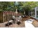 Backyard with shade trees, an outdoor dining set, and view of the screened-in patio at 335 Palmdale Dr, Oldsmar, FL 34677