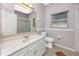 The bathroom features a large vanity, mirror, and tiled floor at 335 Palmdale Dr, Oldsmar, FL 34677