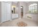 This bathroom offers a tub, shower, and double vanity with tile floors and ample space at 335 Palmdale Dr, Oldsmar, FL 34677