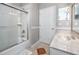 Bathroom featuring a shower-tub combo and vanity with a framed mirror at 335 Palmdale Dr, Oldsmar, FL 34677