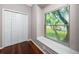 Bedroom features a closet and a large window for ample light at 335 Palmdale Dr, Oldsmar, FL 34677
