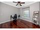 Cozy bedroom boasts a window, desk, and shelf space for storage at 335 Palmdale Dr, Oldsmar, FL 34677