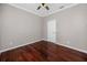 Clean bedroom with hardwood floors and ample wall space, perfect for creating a personalized and restful retreat at 335 Palmdale Dr, Oldsmar, FL 34677