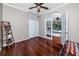 A bedroom features a closet, ladder shelf, and French doors to the pool at 335 Palmdale Dr, Oldsmar, FL 34677