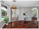 Breakfast nook with bay window, hardwood floors and sliding glass doors leading to the patio at 335 Palmdale Dr, Oldsmar, FL 34677
