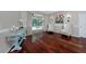 Living room with hardwood floors and sliding glass doors leading to the pool area at 335 Palmdale Dr, Oldsmar, FL 34677