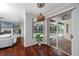 View of the pool from inside the living room with a neutral couch and decorative fixtures at 335 Palmdale Dr, Oldsmar, FL 34677