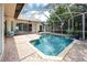 Sparkling pool in a screened-in lanai offers a relaxing outdoor living space at 335 Palmdale Dr, Oldsmar, FL 34677