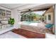 Inviting view of screened pool area from inside, showing stylish decor and comfortable seating at 335 Palmdale Dr, Oldsmar, FL 34677