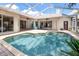 Inviting screened-in pool with brick patio and ample space for outdoor lounging and entertaining at 335 Palmdale Dr, Oldsmar, FL 34677