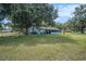 Large backyard with mature trees and fencing at 3440 Pittman Rd, Dover, FL 33527