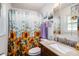 Cozy bathroom with sunflower shower curtain and granite countertop at 3440 Pittman Rd, Dover, FL 33527