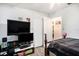 Modest bedroom with a ceiling fan, closet and doorway to another bedroom at 3440 Pittman Rd, Dover, FL 33527