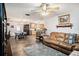 Inviting living room open to kitchen with wood-look flooring and neutral colors at 3440 Pittman Rd, Dover, FL 33527