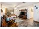 Cozy living room featuring wood-look floors and a large entertainment center at 3440 Pittman Rd, Dover, FL 33527