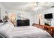 Main bedroom leading to the main bathroom, natural light and wood-look floors at 3440 Pittman Rd, Dover, FL 33527