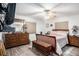 Main bedroom featuring wood-look floors, a ceiling fan, natural light, and a dresser at 3440 Pittman Rd, Dover, FL 33527