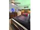 Inviting bedroom featuring wood headboard, nightstands, and cozy decor for a relaxing and comfortable retreat at 3984 Maurice Ave, Odessa, FL 33556
