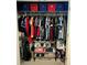 Organized closet featuring hanging clothes, shelving units, and storage containers for efficient and tidy storage solutions at 3984 Maurice Ave, Odessa, FL 33556