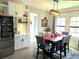 Cozy dining area with built-in cabinets and a modern chandelier at 3984 Maurice Ave, Odessa, FL 33556