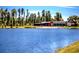 Exterior view of a modern building by a lake, offering scenic views and a serene environment for community engagement at 3984 Maurice Ave, Odessa, FL 33556