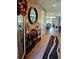 Welcoming foyer with wood floors and an open view of the living spaces at 3984 Maurice Ave, Odessa, FL 33556