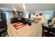 Spacious game room featuring a ping pong table, comfortable seating, and ample lighting at 3984 Maurice Ave, Odessa, FL 33556