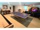 Entertaining game room with ping pong table, shuffleboard, and comfortable seating at 3984 Maurice Ave, Odessa, FL 33556