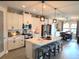 Bright kitchen with white cabinets, stainless steel appliances, and a center island at 3984 Maurice Ave, Odessa, FL 33556