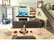 Open-concept living room featuring a fireplace, TV, and comfortable seating at 3984 Maurice Ave, Odessa, FL 33556