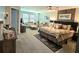 Spacious main bedroom featuring a comfortable bed, ample natural light, and a seating area at 3984 Maurice Ave, Odessa, FL 33556